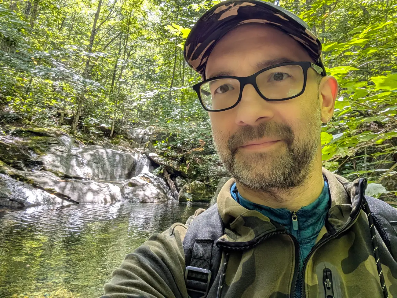 Mat on a forest hike, beside a waterfall